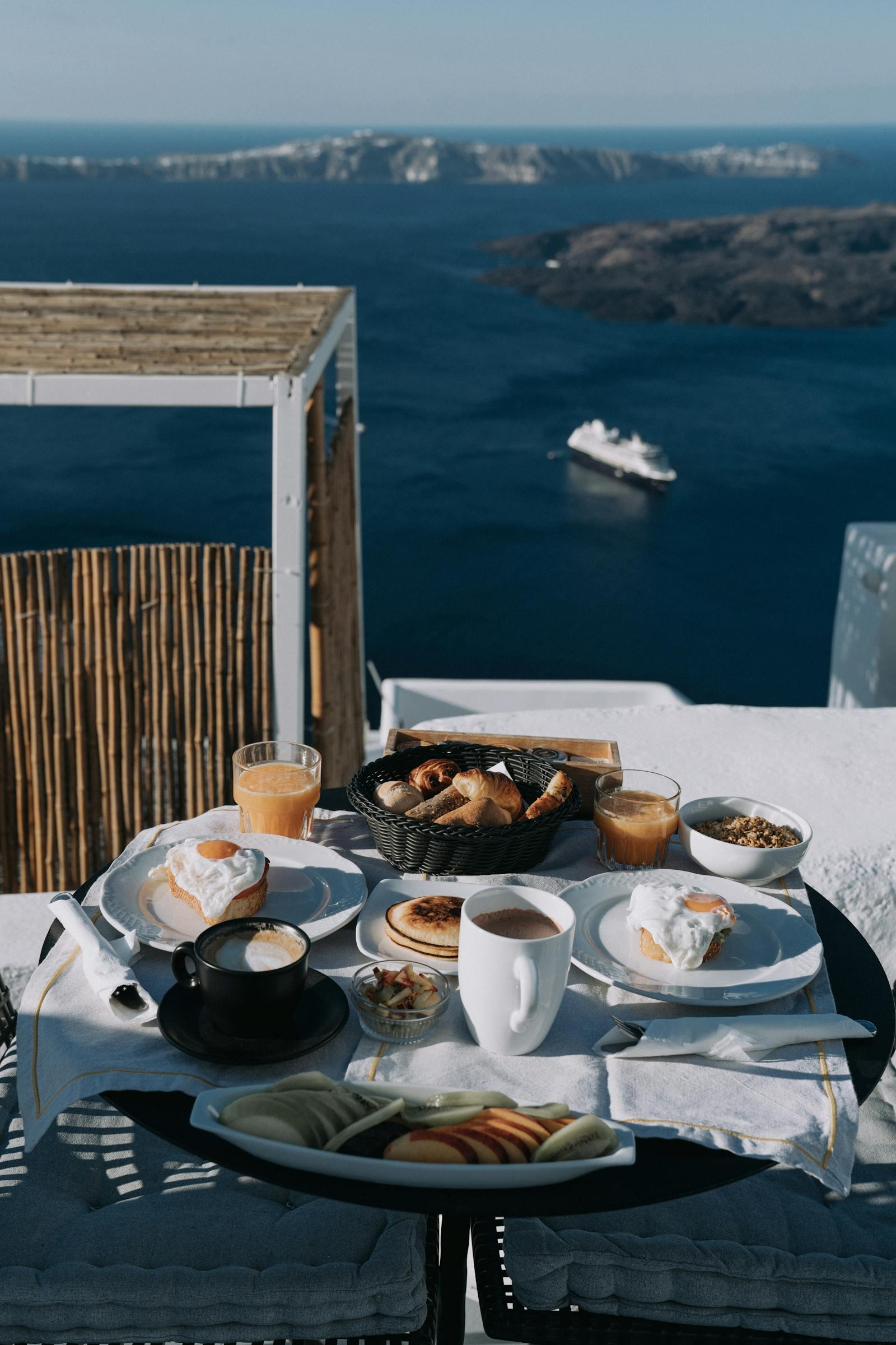 Hotel breakfast setup on a balcony with sea view