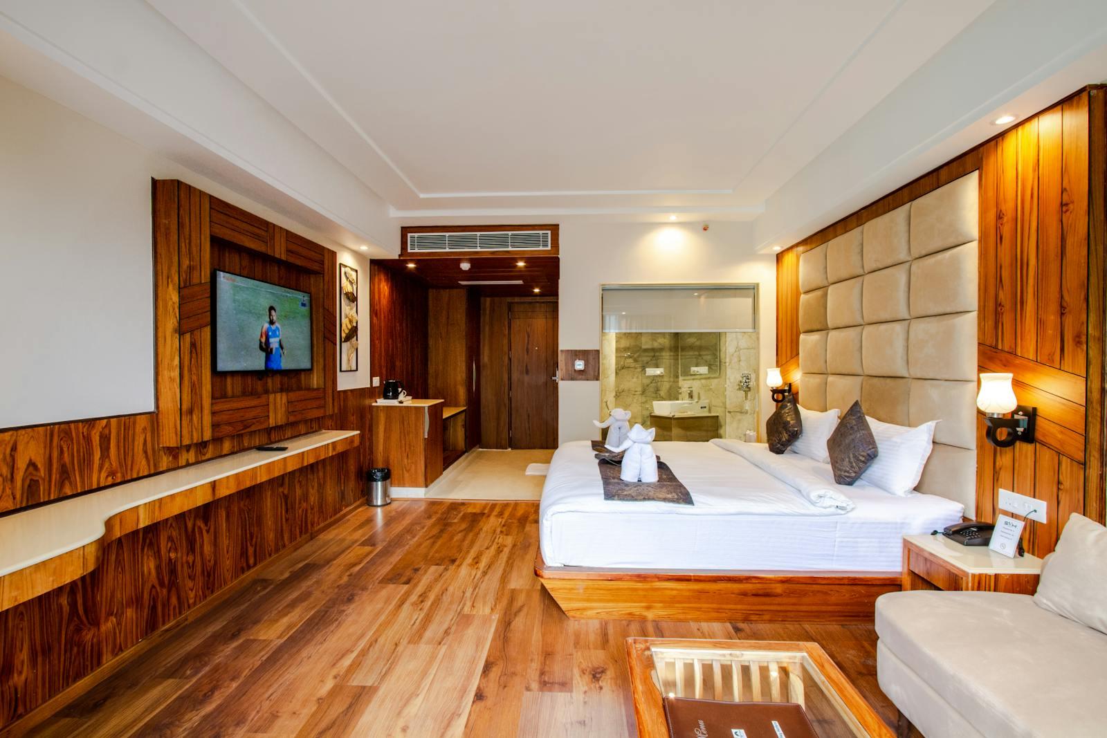 Modern hotel room interior with bed and TV