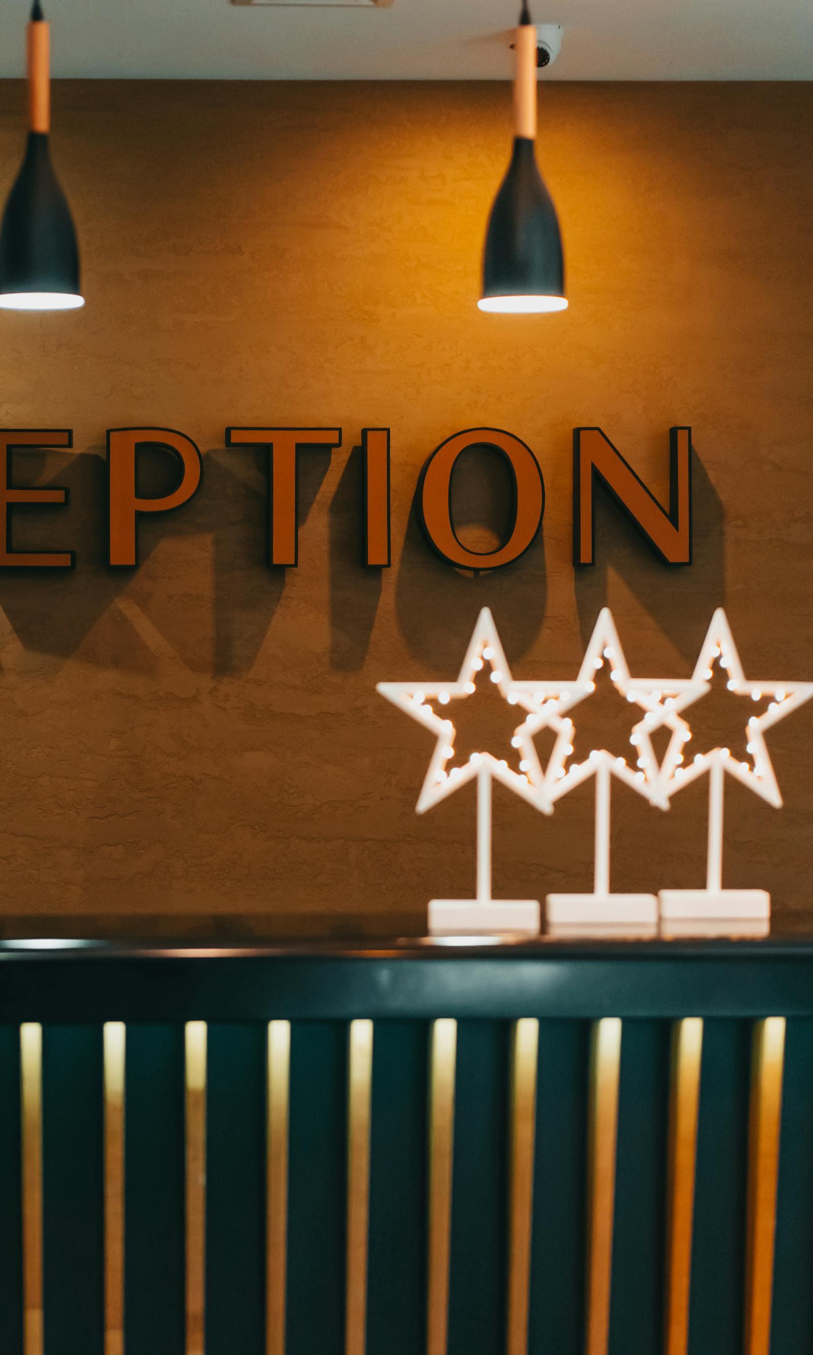 Hotel reception sign decorated with star lights